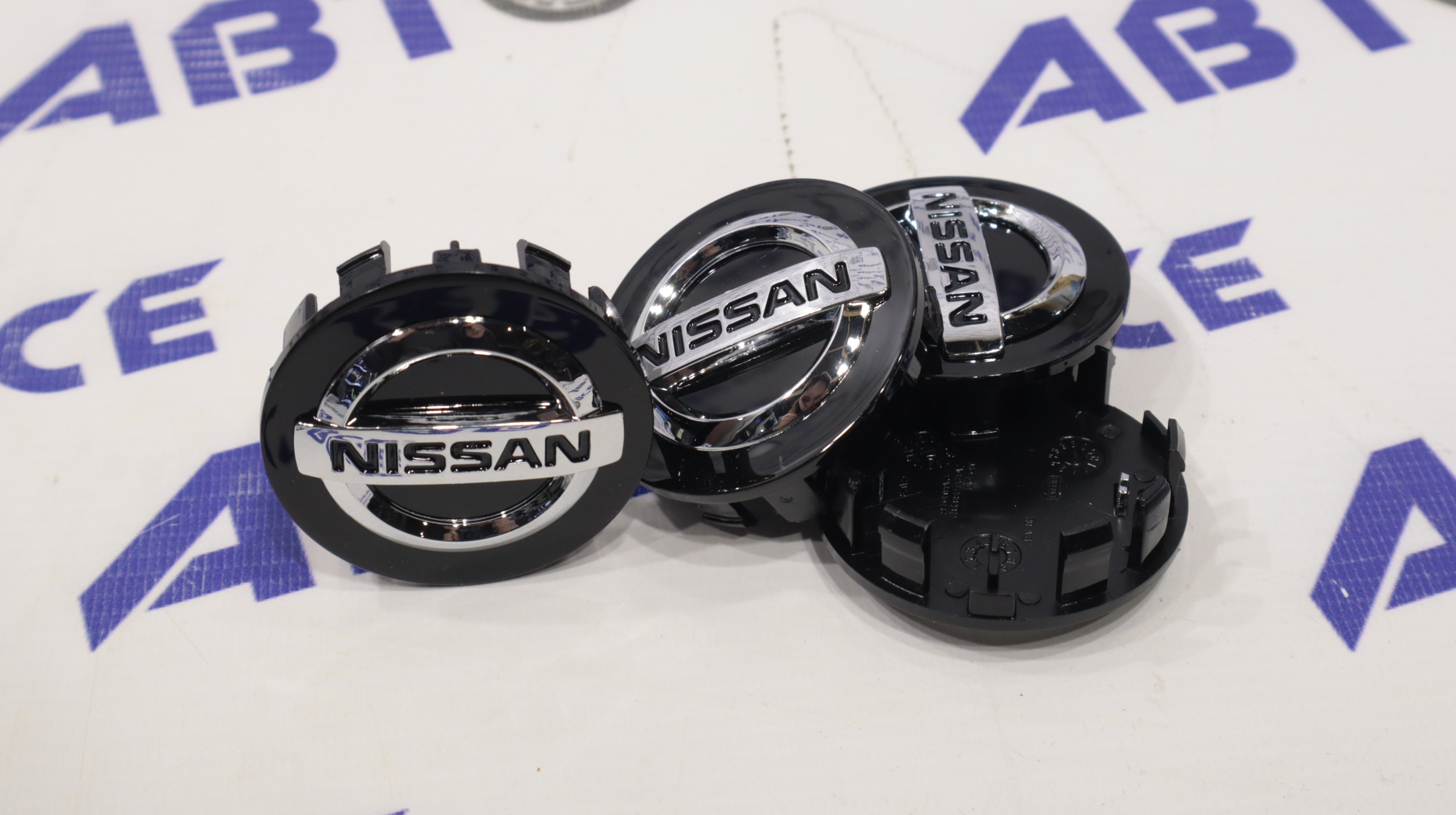 Колпачок ступицы (пластик) комплект 4шт NISSAN черные хром (49-53мм)